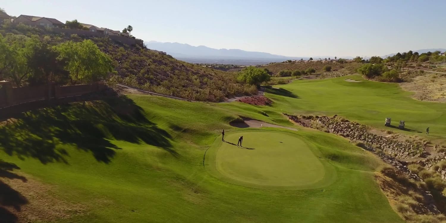 Revere Golf Club — Las Vegas desert basin golf with rocky backdrop.